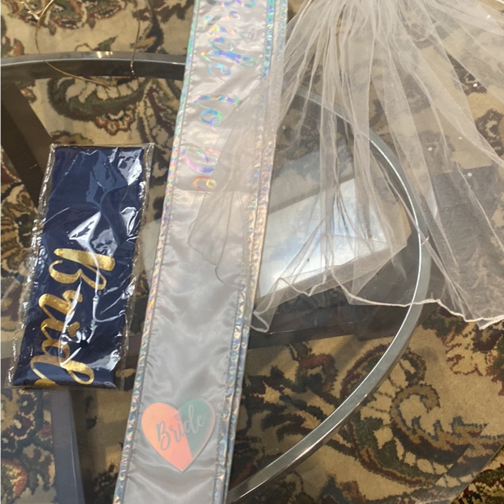 2 bride sashes and a decorative veil